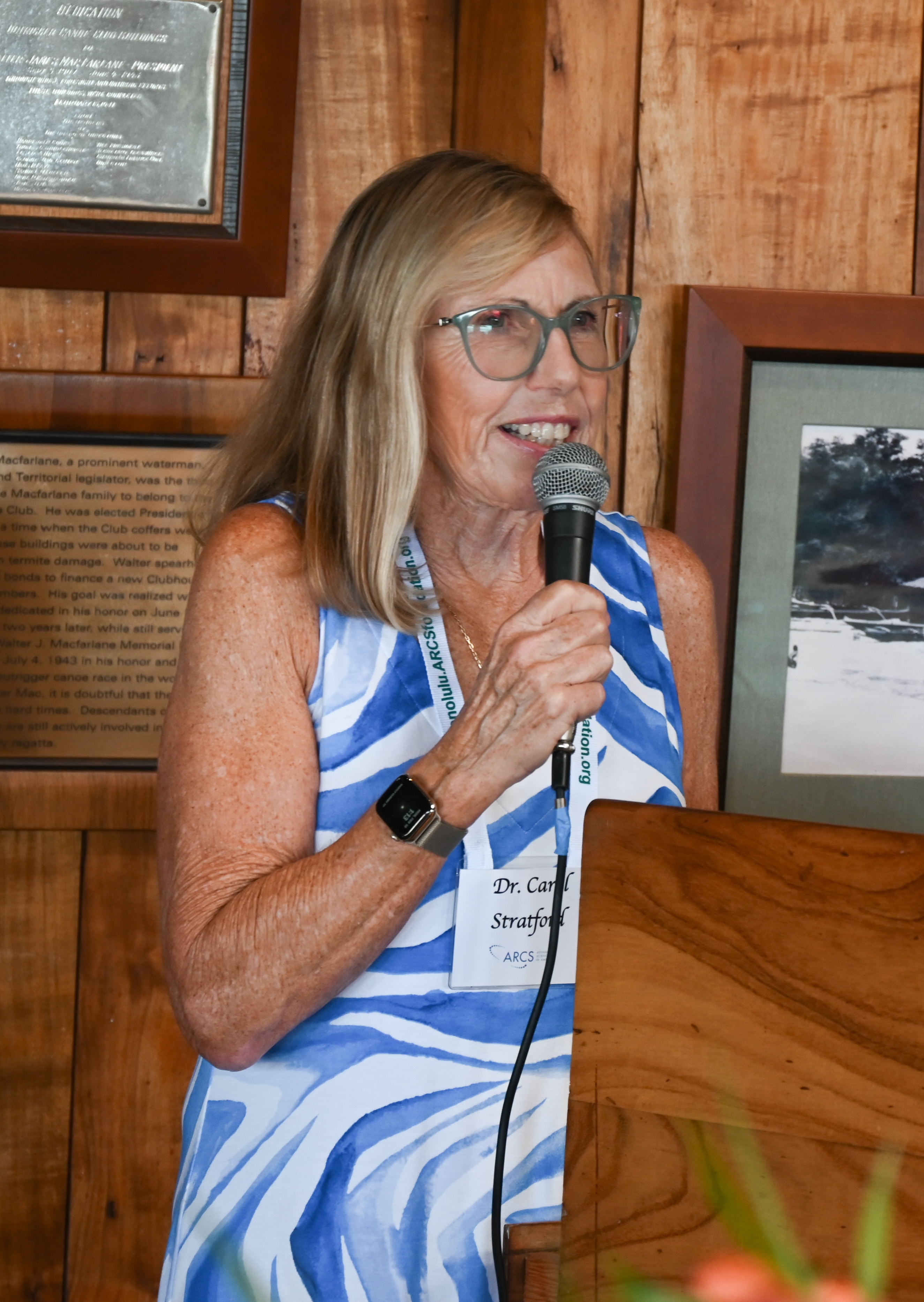 Dr. Carol Stratford with microphone