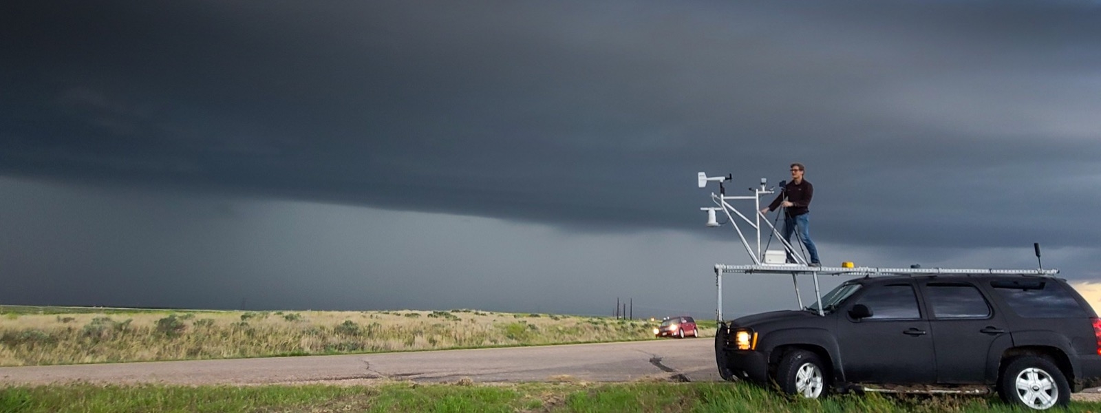 ARCS Scholar TJ Corrigan atop storm chase car