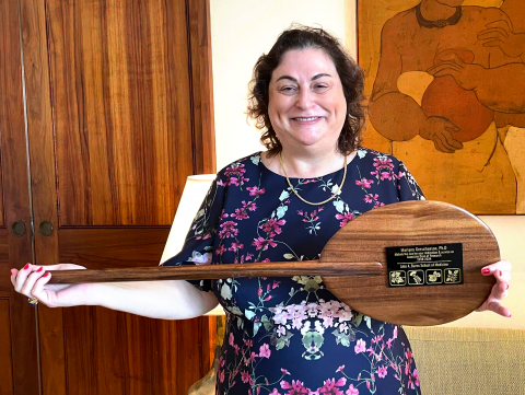 Mariana Gerschenson holding paddle plaque