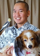 Jason Higa with bird and dog