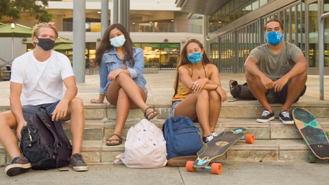 Masked students on the UH Manoa campus